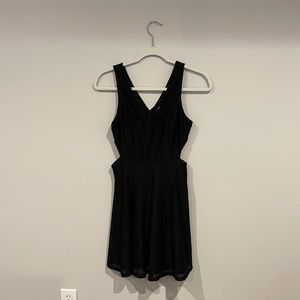 Black v cut dress with cut outs on the side. New with tags!